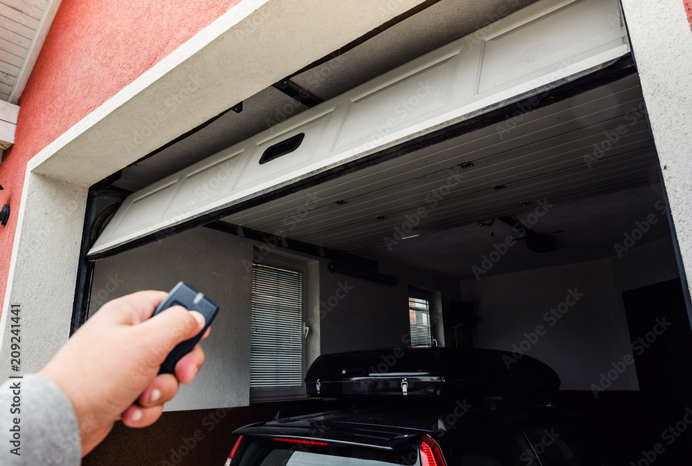 homeowner opening garage door