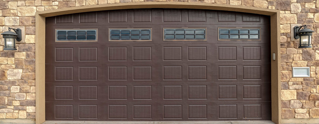 brick home with brown garage door